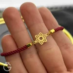 دستبند مارشال زرشکی با پلاک طلای گل